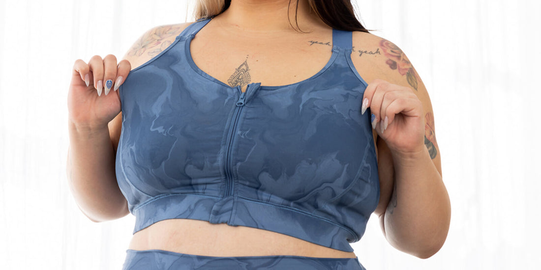 Plus size model wears size 2X zip front sports bra for running