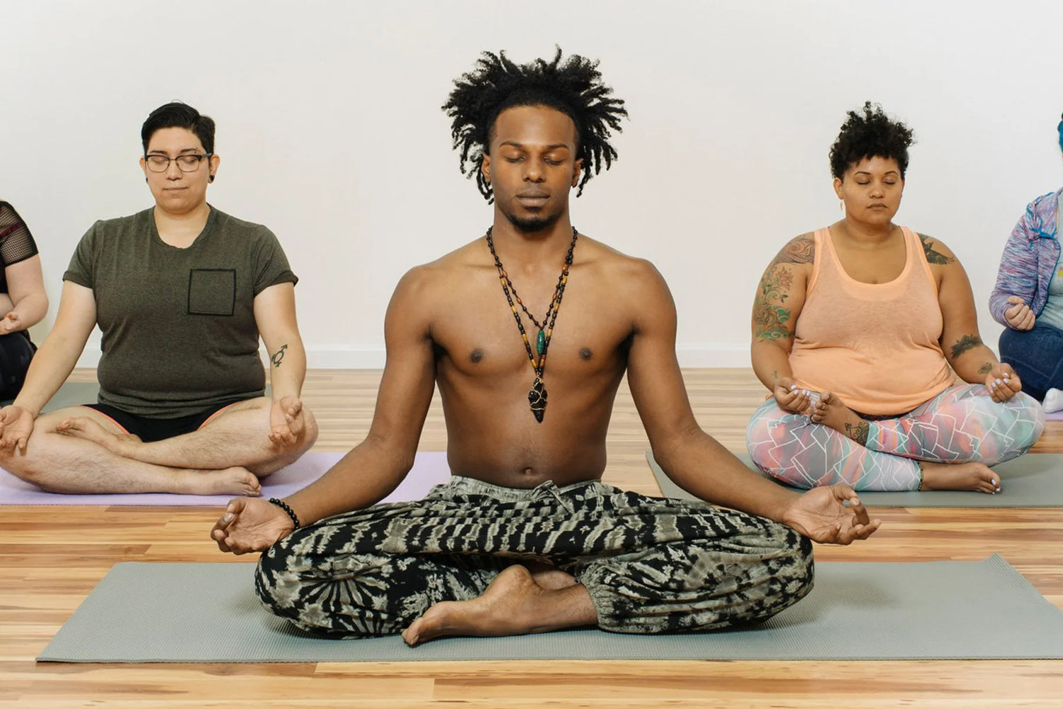 Group of people practicing meditation together