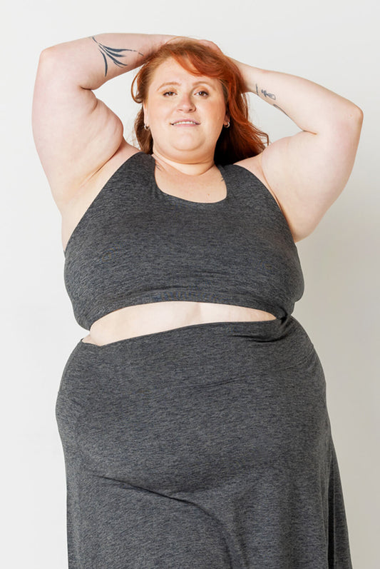 Plus size model wearing Superfit Hero SuperSoft Strappy Bra in Heather Gray