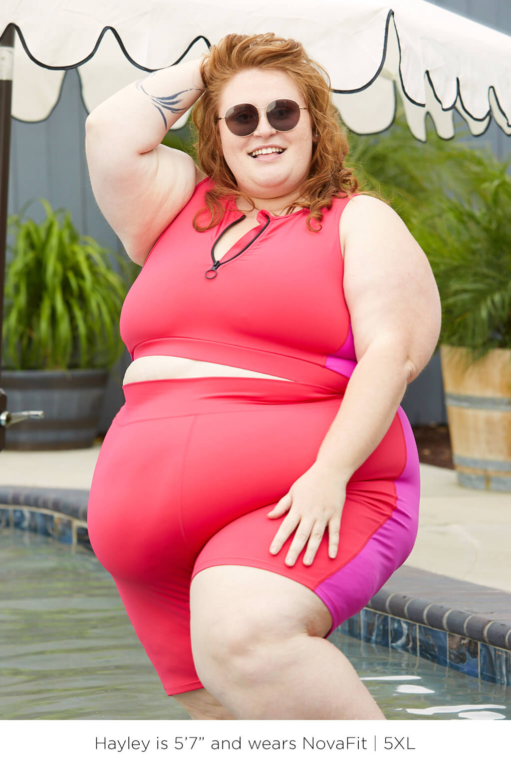 Plus size model wearing 9 Inch Swim Shorts Colorblock Fuchsia in size 5XL.